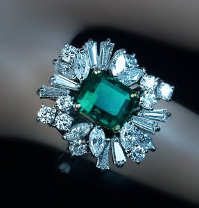 vintage emerald and diamond engagement cluster ring