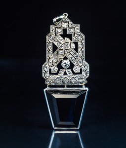 Art Deco openwork platinum diamond and tapered step cut sapphire pendant