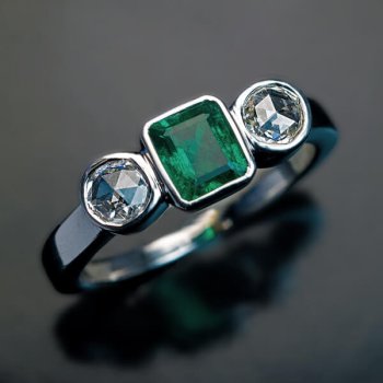 vintage emerald and diamond three stone ring