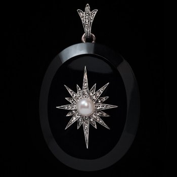 antique Victorian jet locket pendant with a diamond and pearl star