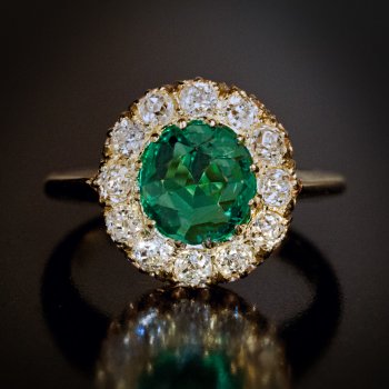 Antique emerald and old mine cut diamond engagement ring