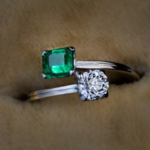 Vintage emerald diamond bypass engagement ring