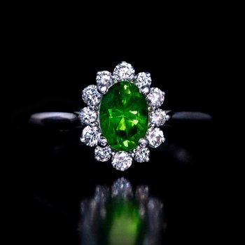 Demantoid and diamond engagement ring