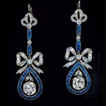Belle Epoque antique bow motif diamond and calibre cut sapphire dangle earrings