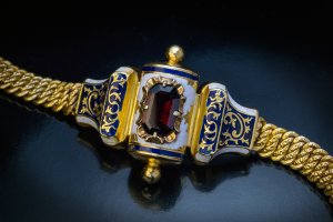 Antique Jewish jewelry - a gold, garnet and enamel 19th century torah scroll bracelet