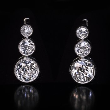 Old mine cut diamond three stone vintage earrings