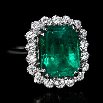 Emerald and diamond cluster rings