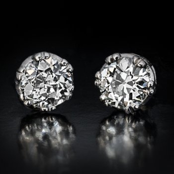 Vintage solitaire diamond earrings set with old European cut diamonds
