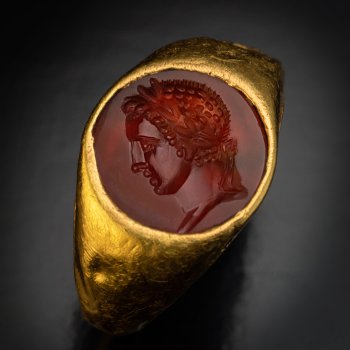 Ancient jewelry - a Roman gold ring with a sard intaglio of an emperor or a military commander circa 1st - 2nd century AD