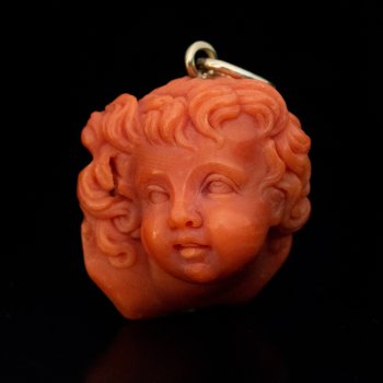 Antique Italian carved coral putto