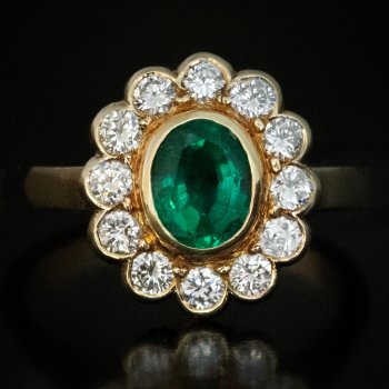 Vintage emerald and diamond engagement cluster ring